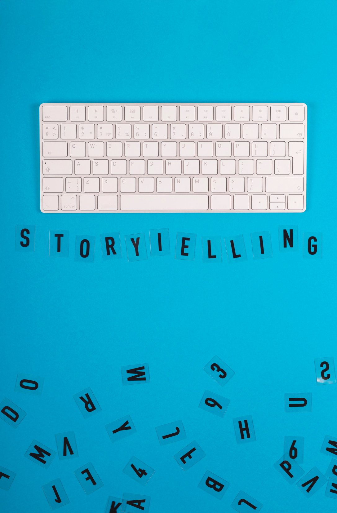 Storytelling Word on Blue Surface with Keyboard